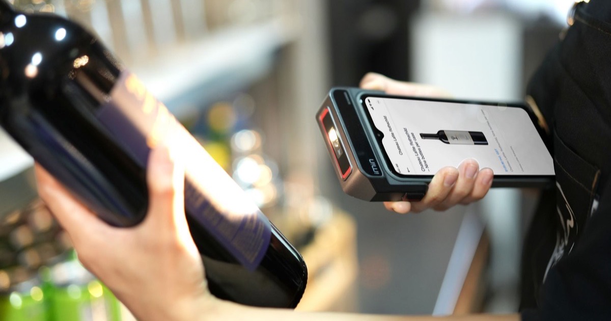 Barcode scanner billing groceries at a POS counter
