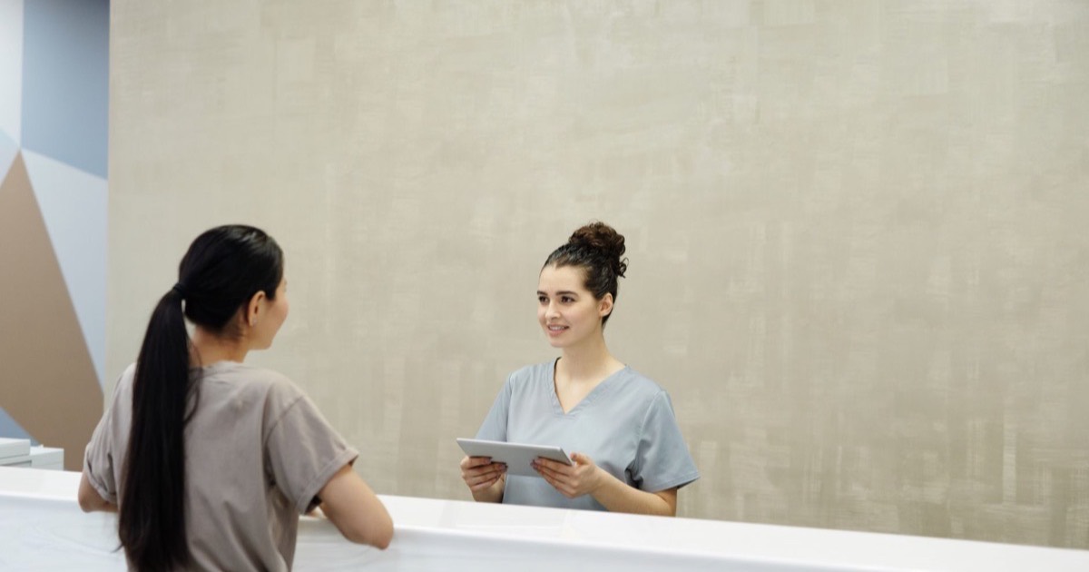 Hospital management software on a screen at a reception
