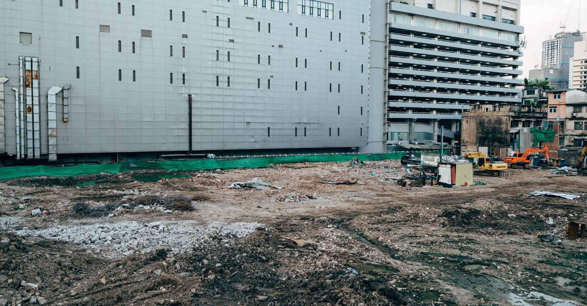 Under-construction residential towers representing a builder using real estate CRM and ERP software in India